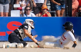 Dilworth-Glyndon-Felton catcher Skylar Spessard (10) tags out St. Charles runner Emma Chuchna (11) at home plate for the final out in the seventh inni