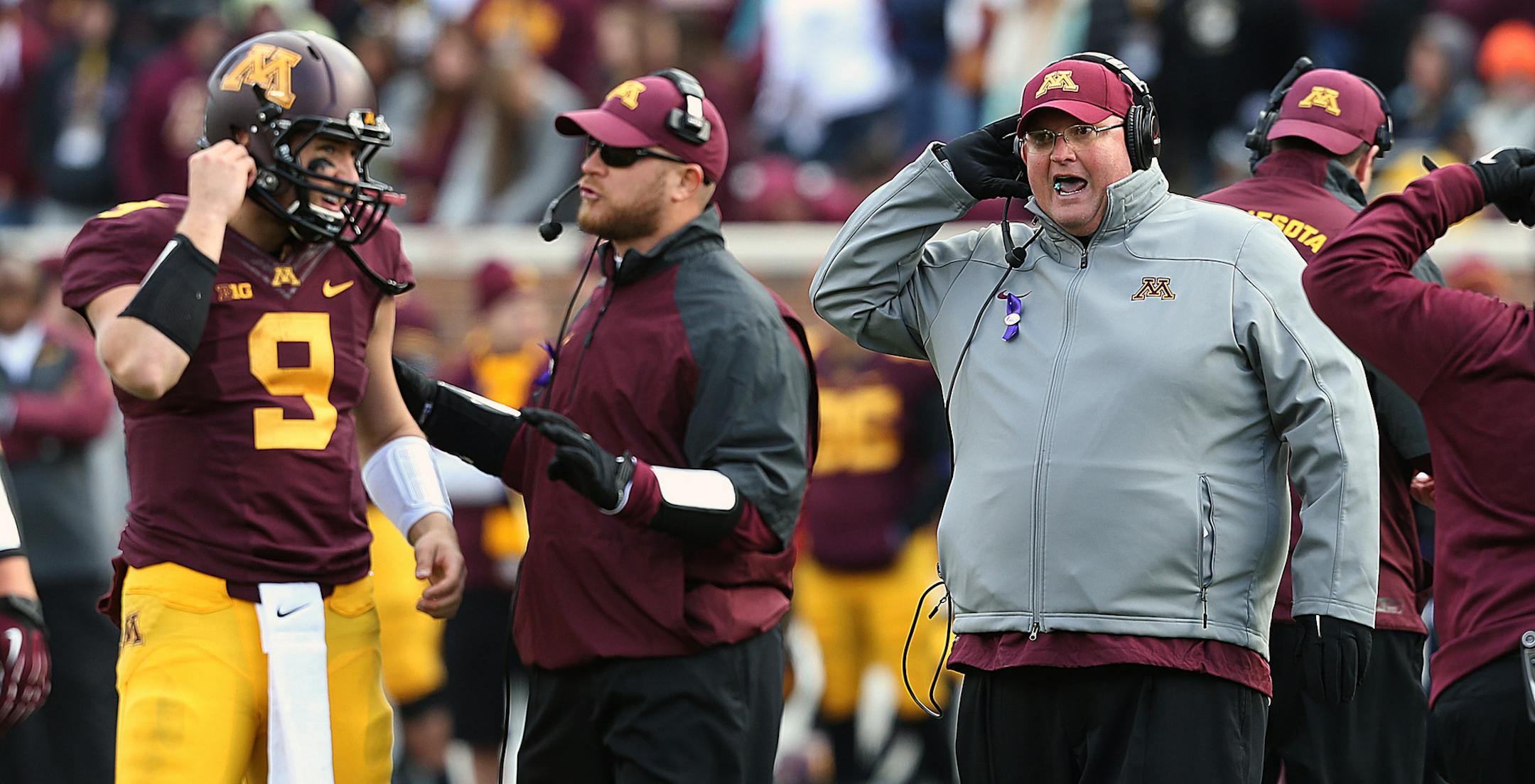 Acting Gopher head coach Tracy Claeys (right) shouted instruction to quarterback Philip Nelson late in the game. ] JIM GEHRZ &#x201a;&#xc4;&#xa2; jgehrz@startribune.com Minneapolis, MN / Oct 27, 2013, 11:00 AM BACKGROUND INFORMATION- The Minnesota Golden Gopher football team played the Nebraska Cornhuskers at TCF Bank Stadium. Minnesota won, 34-23.