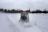 Jeff VanGuilder of the Minneapolis Park board cleared snow from an outdoor ice rink at Logan Park in Northeast Minneapolis on Tuesday.