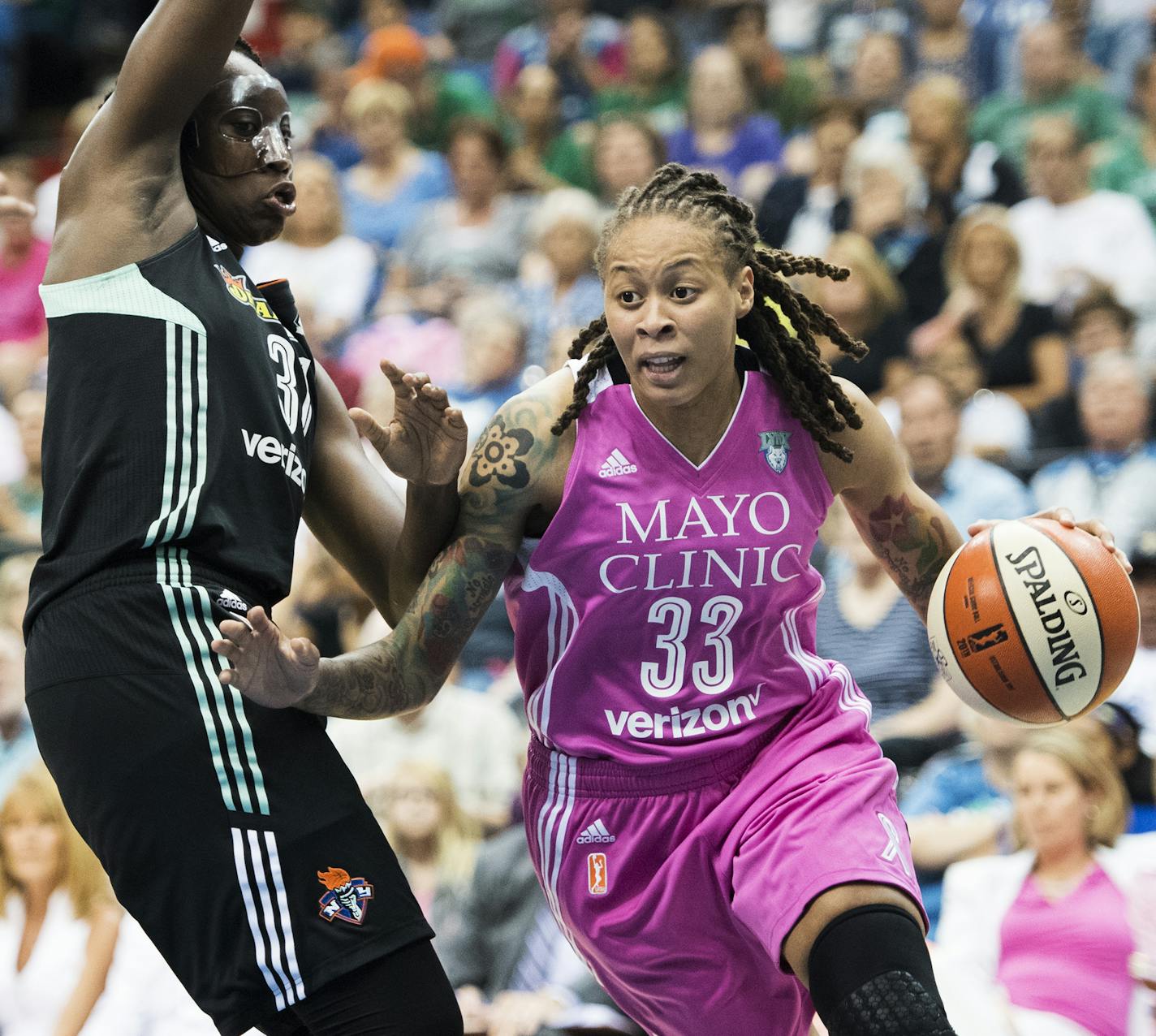 Minnesota Lynx guard Seimone Augustus (33) drove towards the hoop past New York Liberty guard Tanisha Wright (30). ] Isaac Hale &#xef; isaac.hale@startribune.com The Minnesota Lynx took on the New York Liberty at the Target Center on Friday, July 15, 2016.