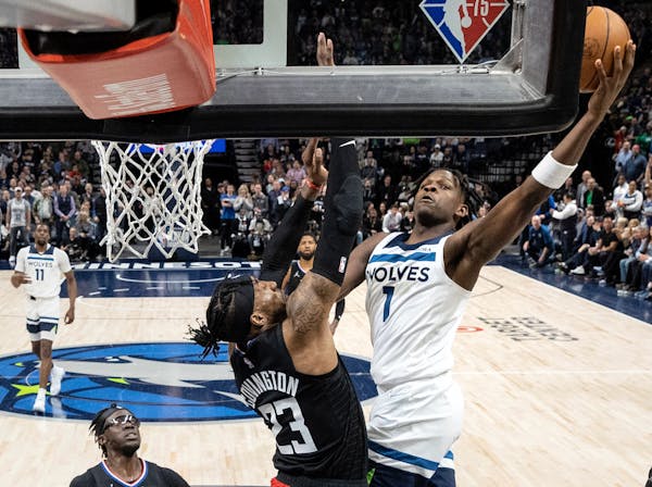Anthony Edwards (1) of the Minnesota Timberwolves attempts a shot in the first half Tuesday, April 12, at Target Center in Minneapolis, Minn. ] CARLOS