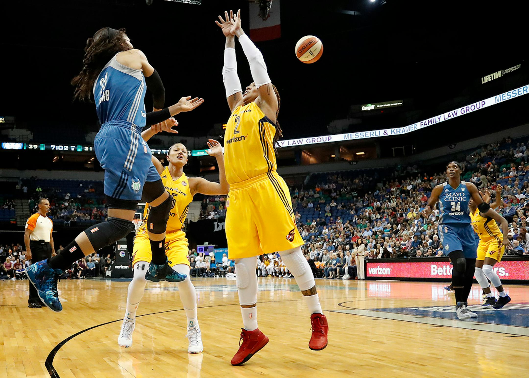 Maya Moore (23) passed the ball past Erlana Larkins (2) in the second quarter