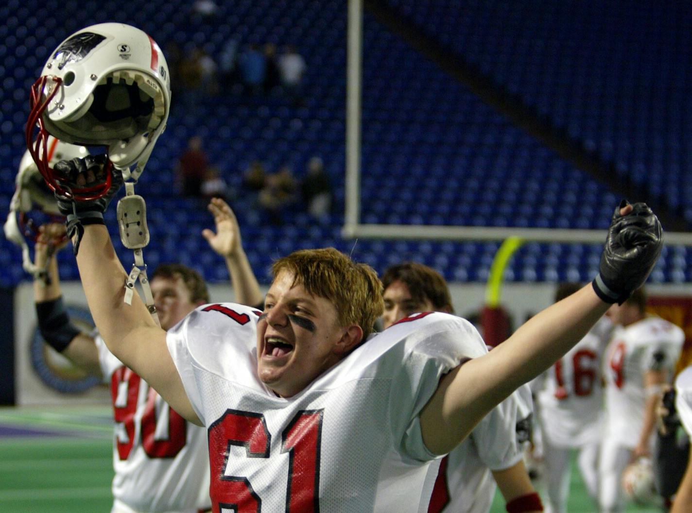 Minneapolis, MN., Saturday, 11/22/2003. Lakeville vs. Hastings. Lakevilles Jake Rongholt and other Panthers celebrate after winning championship.