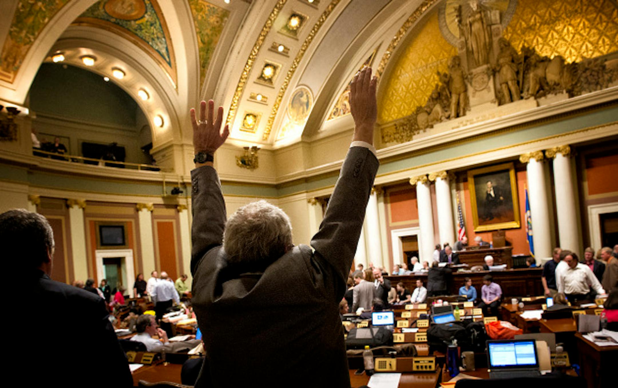 In the final hour of the session, Rep. Clark Johnson stretched during a break in the House as they waited for more information from the Senate  Monday, May 20, 2013  ]   GLEN STUBBE * gstubbe@startribune.com