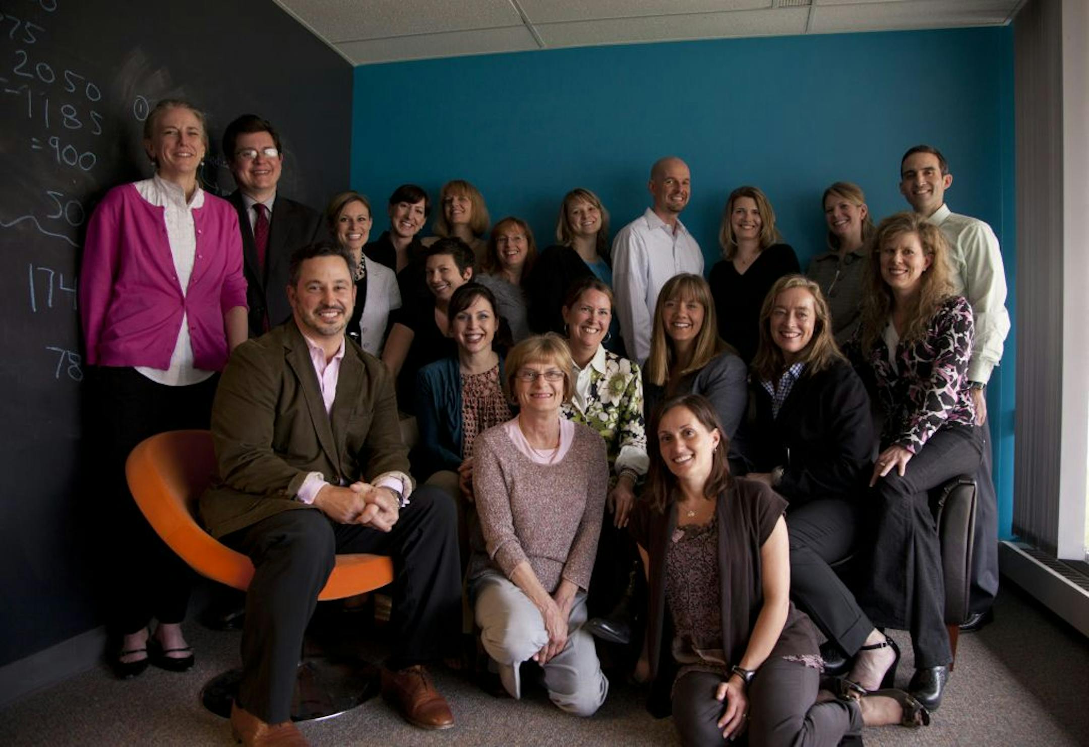 Paul Dominski, seated in the orange chair at left, with the Park Nicollet marketing team in the conference room they use for brainstorming in their St. Louis Park, Minn. office Tuesday afternoon, March 21, 2012.