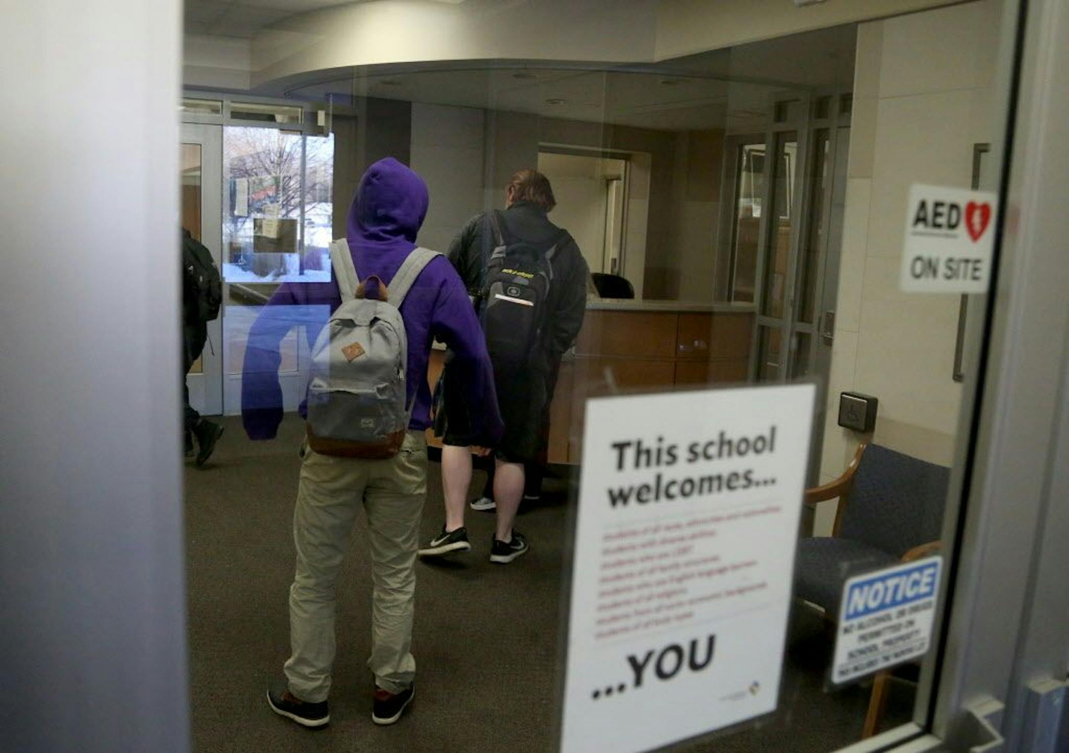 Bloomington Jefferson High School, in response to past mass shootings, has redesigned an renovated the entrance to the high school to protect students and staff in the case of an event. Here, tardy students must be buzzed in by the front entrance security hall monitor before entering the school's front doors Wednesday, Feb. 21, 2018, in Bloomington, MN.