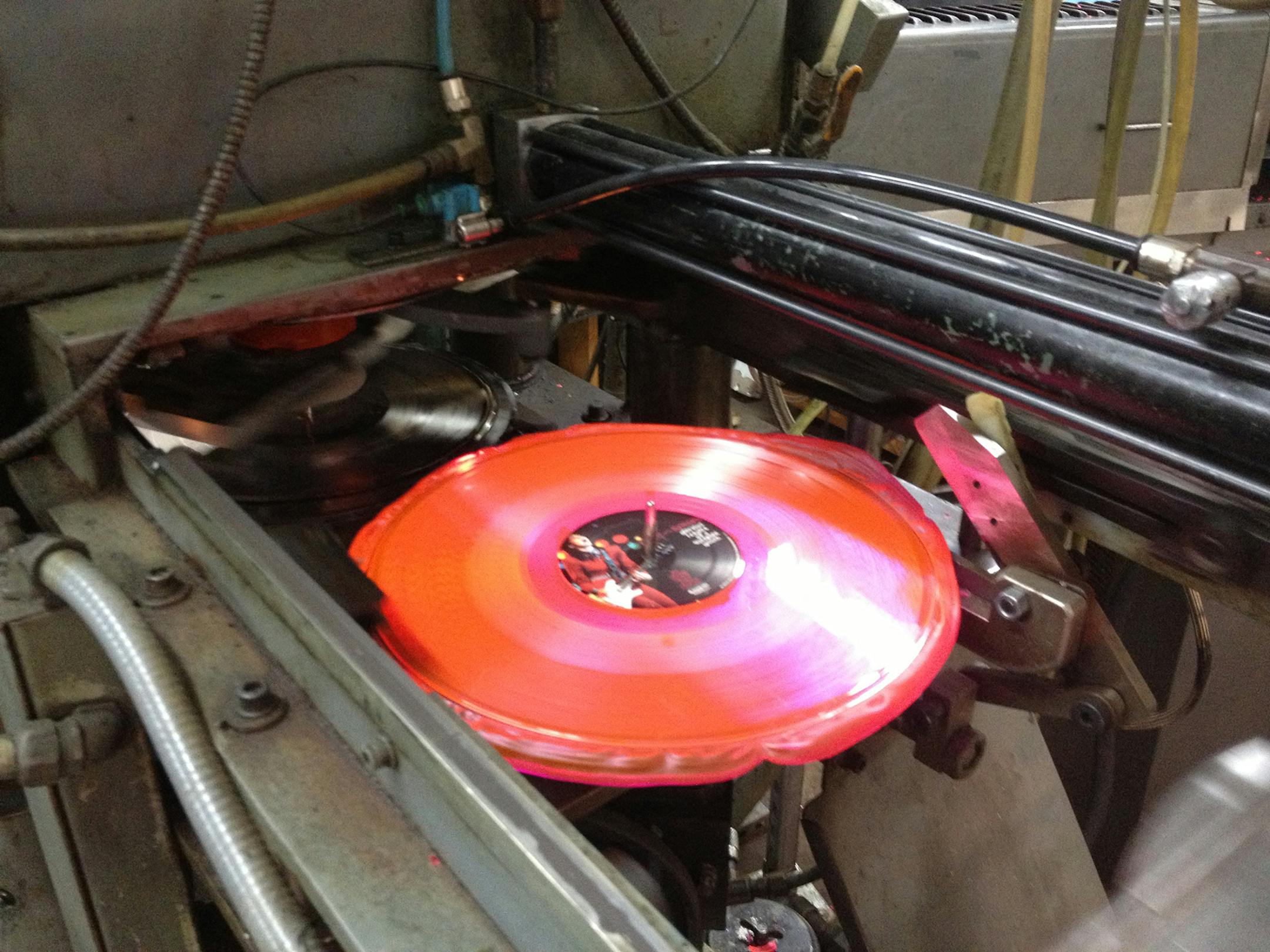 A fluorescent pink vinyl release of Joan Jett and the Blackhearts‚Äô ‚ÄúGlorious Results of a Misspent Youth‚Äù at United Record Pressing. Illustrates MUSIC-VINYL (category e), by Mark Guarino, special to The Washington Post. Moved Friday, Sept. 26, 2014. (MUST CREDIT: United Record Pressing/Jay Millar.)