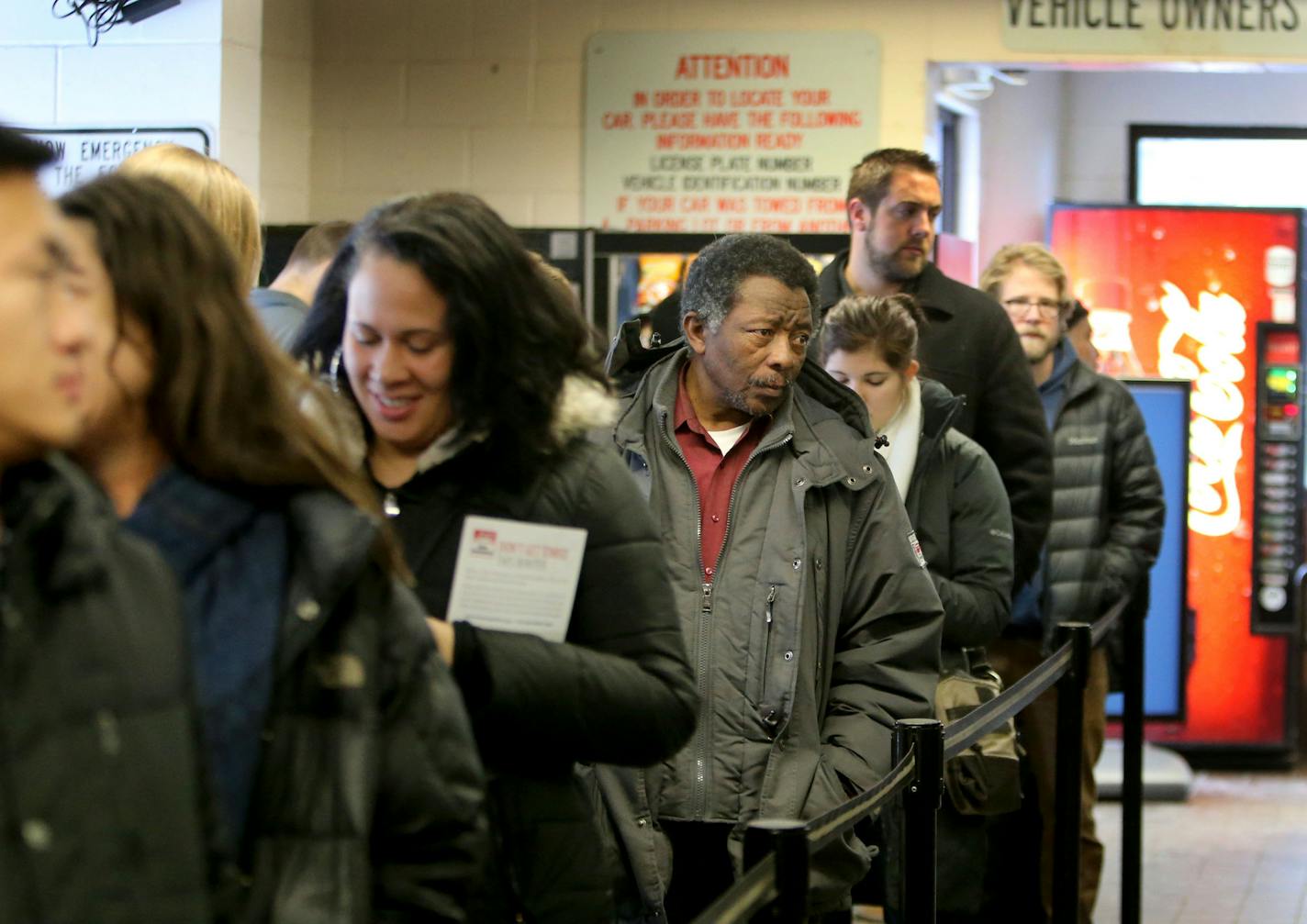 Unhappy car owners wait in line at the ciity of Minneapolis auto impound lot in order to reclaim their towed vehicles Wednesday, Dec. 30, 2015, in Minneapolis, MN.](DAVID JOLES/STARTRIBUNE)djoles@startribune.com St. Paul and Minneapolis have declared snow emergencies and used varied ways to get the word out. Even so, previous declarations have been followed by hundreds of car owners retrieving their wheels and ponying up payments for towing fees and fines.