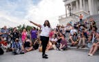 U.S. Rep. Cori Bush, D-Mo., speaks to demonstrators outside the Capitol in Washington on Tuesday, Aug. 3, 2021, after the Biden administration announc