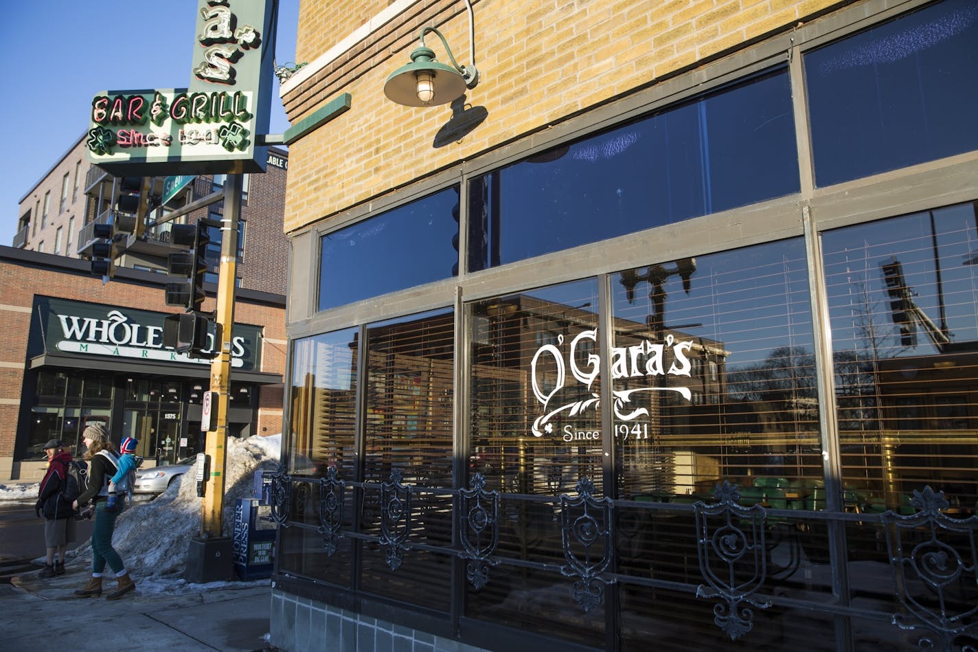 O'Gara's and Whole Foods are seen on the corner of Selby Avenue and Snelling Avenue.