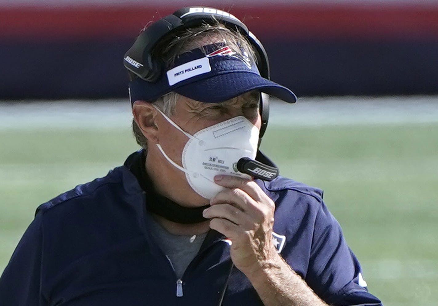 New England Patriots head coach Bill Belichick wears a patch honoring Frederick Douglass "Fritz" Pollard on his visor in the second half of an NFL football game against the Miami Dolphins, Sunday, Sept. 13, 2020, in Foxborough, Mass. Pollard became the first African American head coach in the American Professional Football Association, renamed the National Football League, in 1921 for the Akron Pros. (AP Photo/Steven Senne)