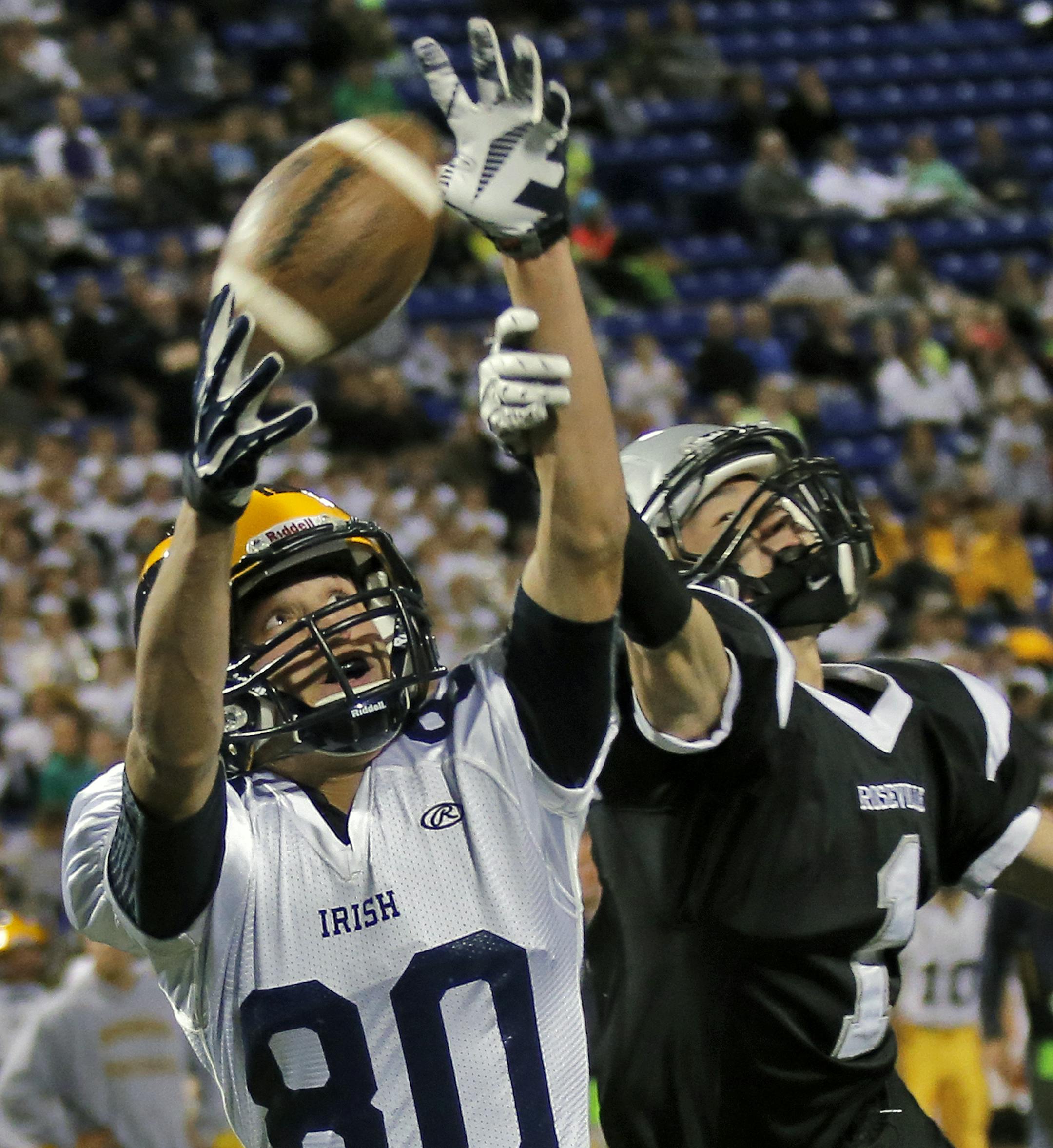 Boys Prep Football Playoffs - Class 6A - Rosemount Irish vs. Roseville Raiders. Irish receiver Tyler Hartigan (80) pulled in a touchdown pass beating Raiders Joh Farmer on the first half play. (MARLIN LEVISON/STARTRIBUNE(mlevison@startribune.com)