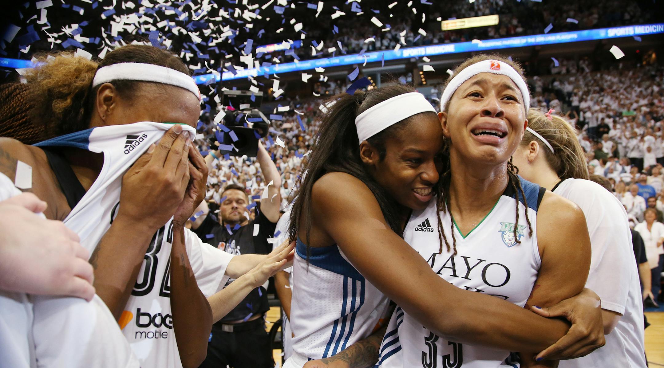 Minnesota Lynx guard Seimone Augustus (33), right, and Minnesota Lynx forward Devereaux Peters (14) celebrate winning the WNBA title. ] (KYNDELL HARKNESS/STAR TRIBUNE) kyndell.harkness@startribune.com Game 5 of the WNBA finals Lynx vs Indiana at the Target Center in Minneapolis, Min., Wednesday October 14, 2015. ORG XMIT: MIN1510142229240512