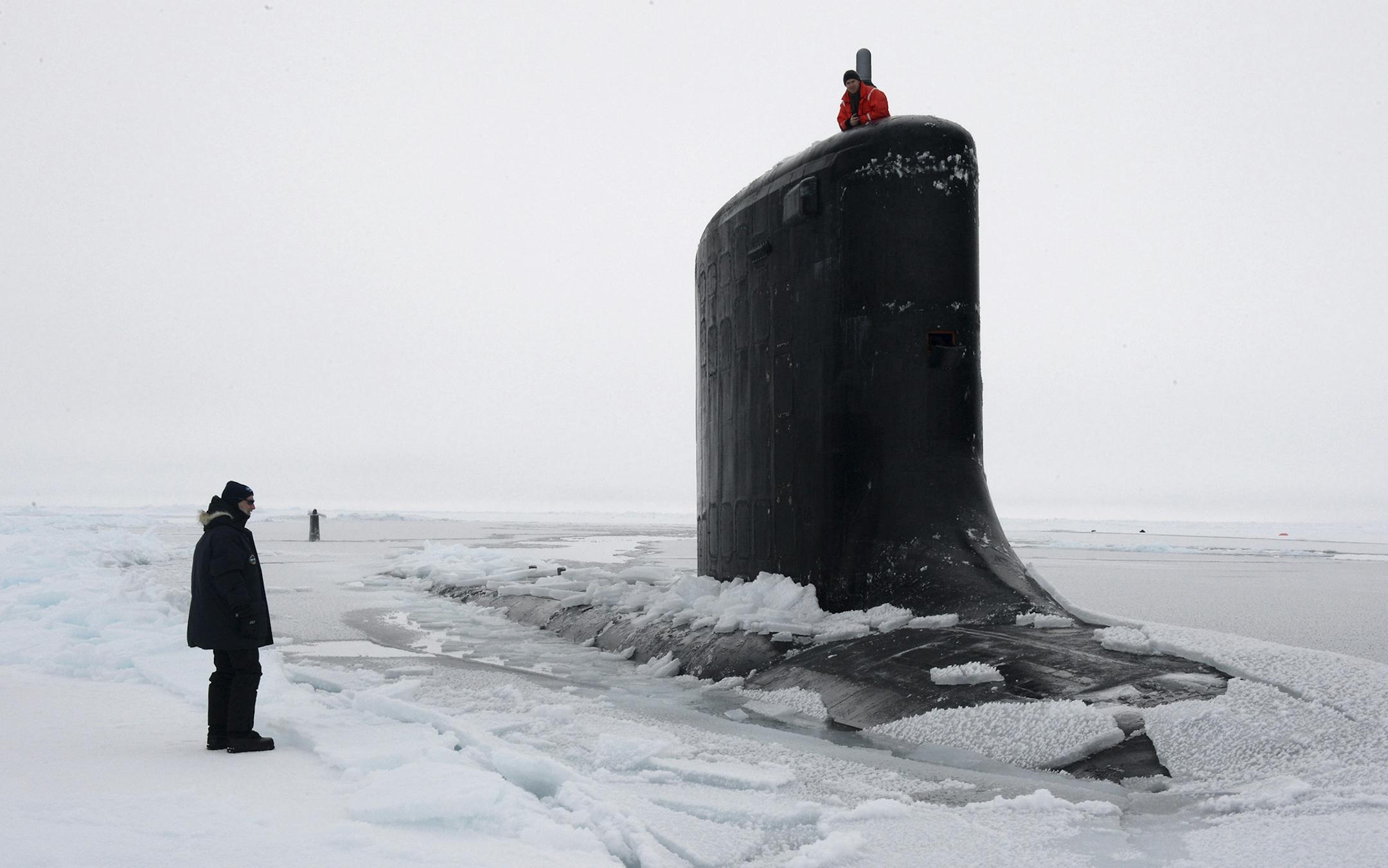 A handout photo of the Virginia-class submarine USS New Mexico as it surfaces through the ice during a United States Navy exercise in the Arctic Ocean, March 22, 2014. Scientist predict, that if warming trends continue, the Arctic's ice cap could well melt enough to allow for commercial shipping year round, and the United States Navy is currently preparing for whatever could unfold in those icy waters. (Joshua Davies Communication Specialist 2nd Class/United States Navy via The New York Times) -