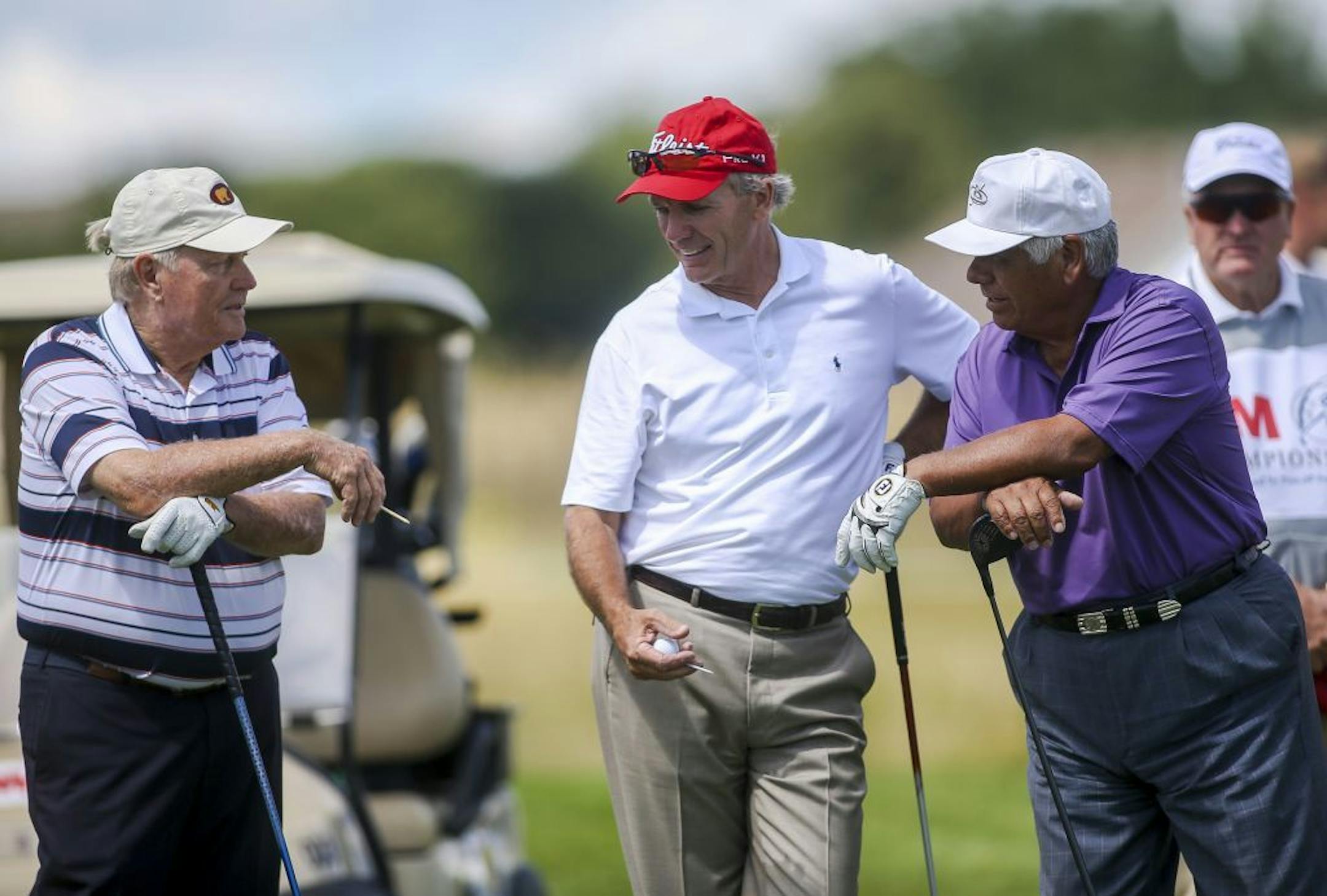 From left, Jack Nicklaus, Jerry Pate and Lee Trevino share a laugh on the ninth hole.