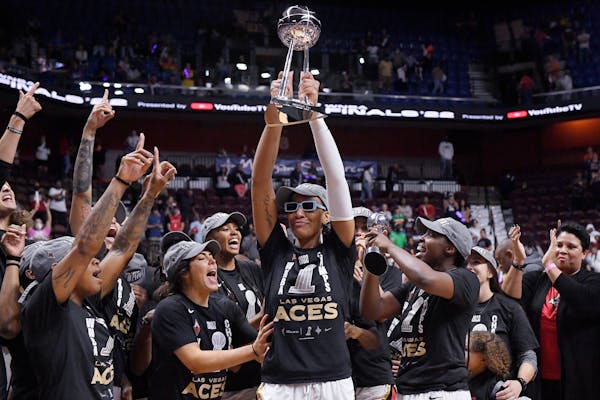 Las Vegas’ A’ja Wilson held up the championship trophy after the Aces won the title in 2022. Wilson was the league’s MVP.
