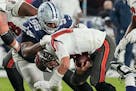 Dallas Cowboys defensive tackle Johnathan Hankins (95) sacks Tampa Bay Buccaneers quarterback Tom Brady (12) during the NFC Wild-Card Game.