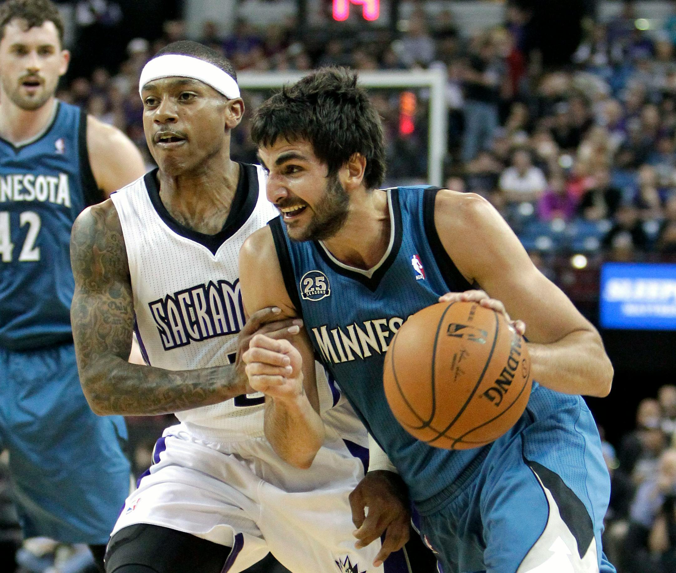 Minnesota Timberwolves guard Ricky Rubio, of Spain, right, drives to the basket past Sacramento Kings guard Isaiah Thomas during the first quarter of an NBA basketball game in Sacramento, Calif., Saturday, March 1, 2014.(AP Photo/Rich Pedroncelli)