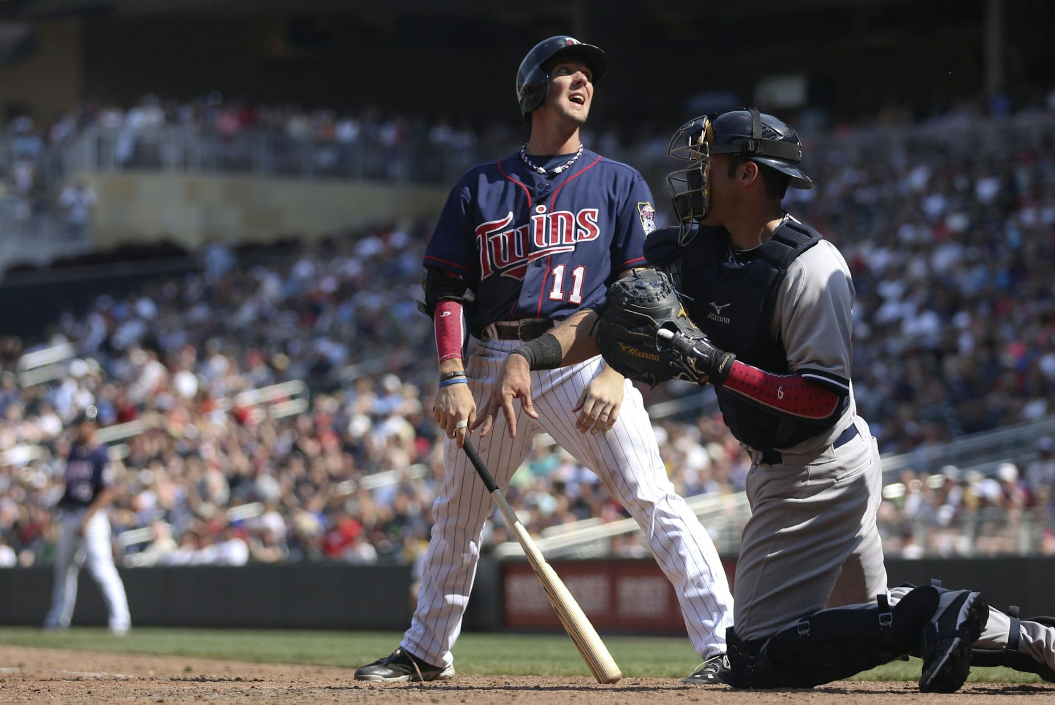 The Twins' Clete Thomas reacted after being called out on strikes in the eighth inning against the Yankees at Target Field on Thursday in a 9-5 defeat.