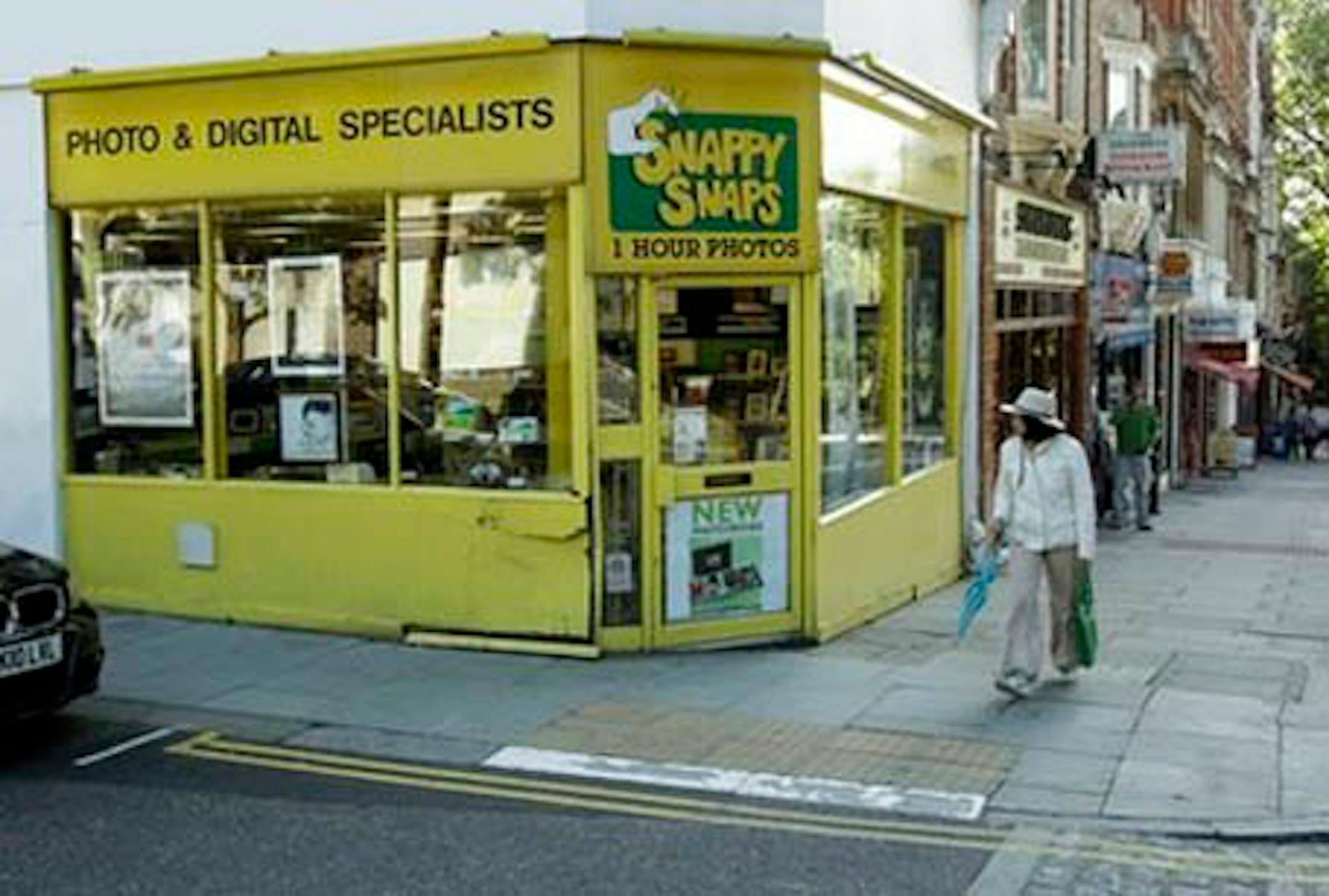 Damage is seen to wooden panelling and windows on the facade of a branch of the photographic store Snappy Snaps in the Hampstead area of London, following allegations that it was driven into by singer George Michael, Tuesday, Aug. 24, 2010. Michael is due to appear in court on Tuesday charged with driving under the influence of drugs following the incident in the early hours of Sunday July 4. The words "Wham" and "! By George" have since been written on the paneling. "Wham!" is the name of the pop duo that led to Michael's rise to fame as a singer in the 1980s. (AP Photo/Matt Dunham)