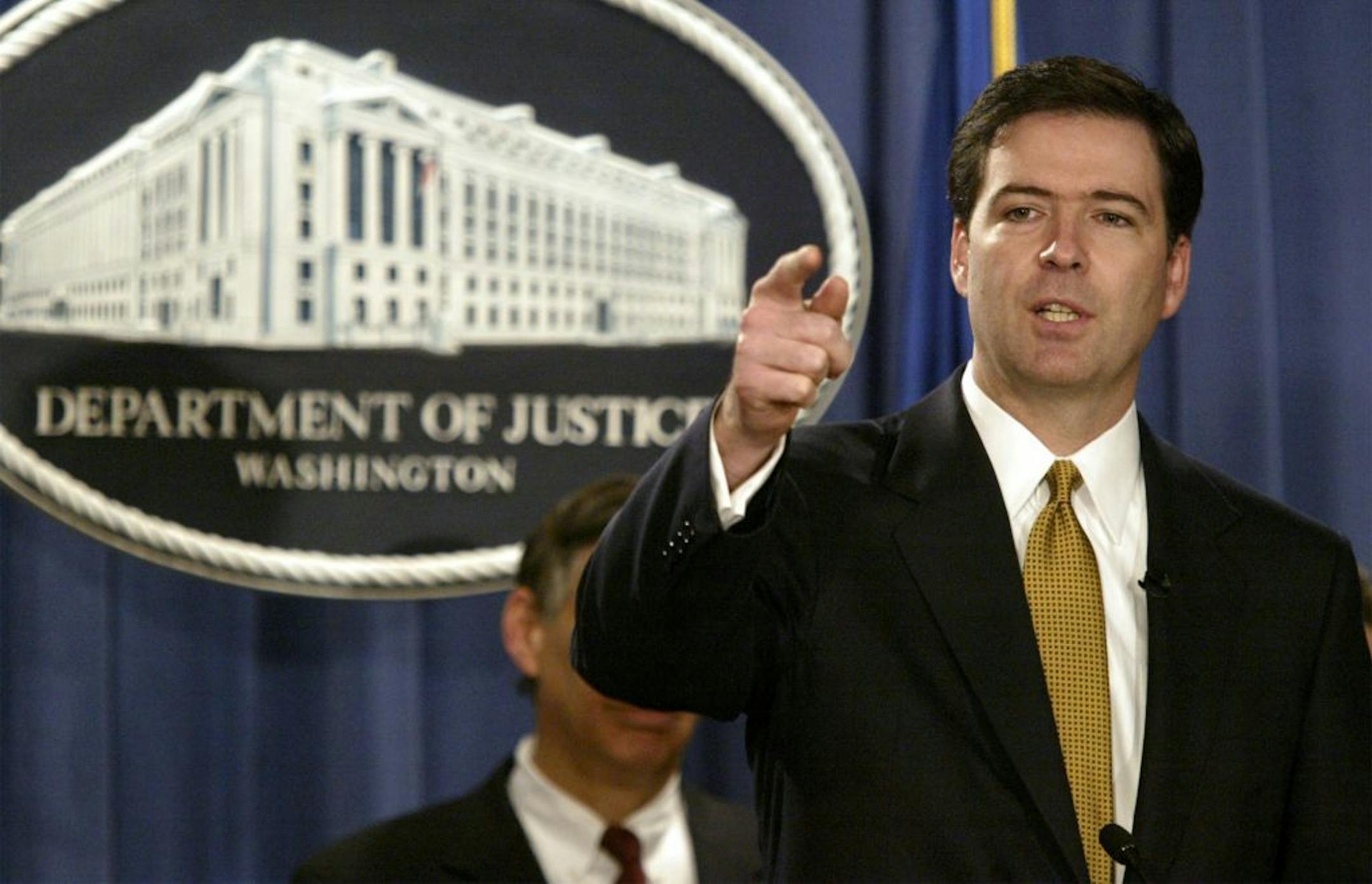 FILE - In this Jan. 14, 2004 file photo, Deputy Attorney General James Comey gestures during a news conference in Washington. President Barack Obama is preparing to nominate former Bush administration official James Comey to head the FBI, people familiar with the decision said Wednesday, May 29, 2013.