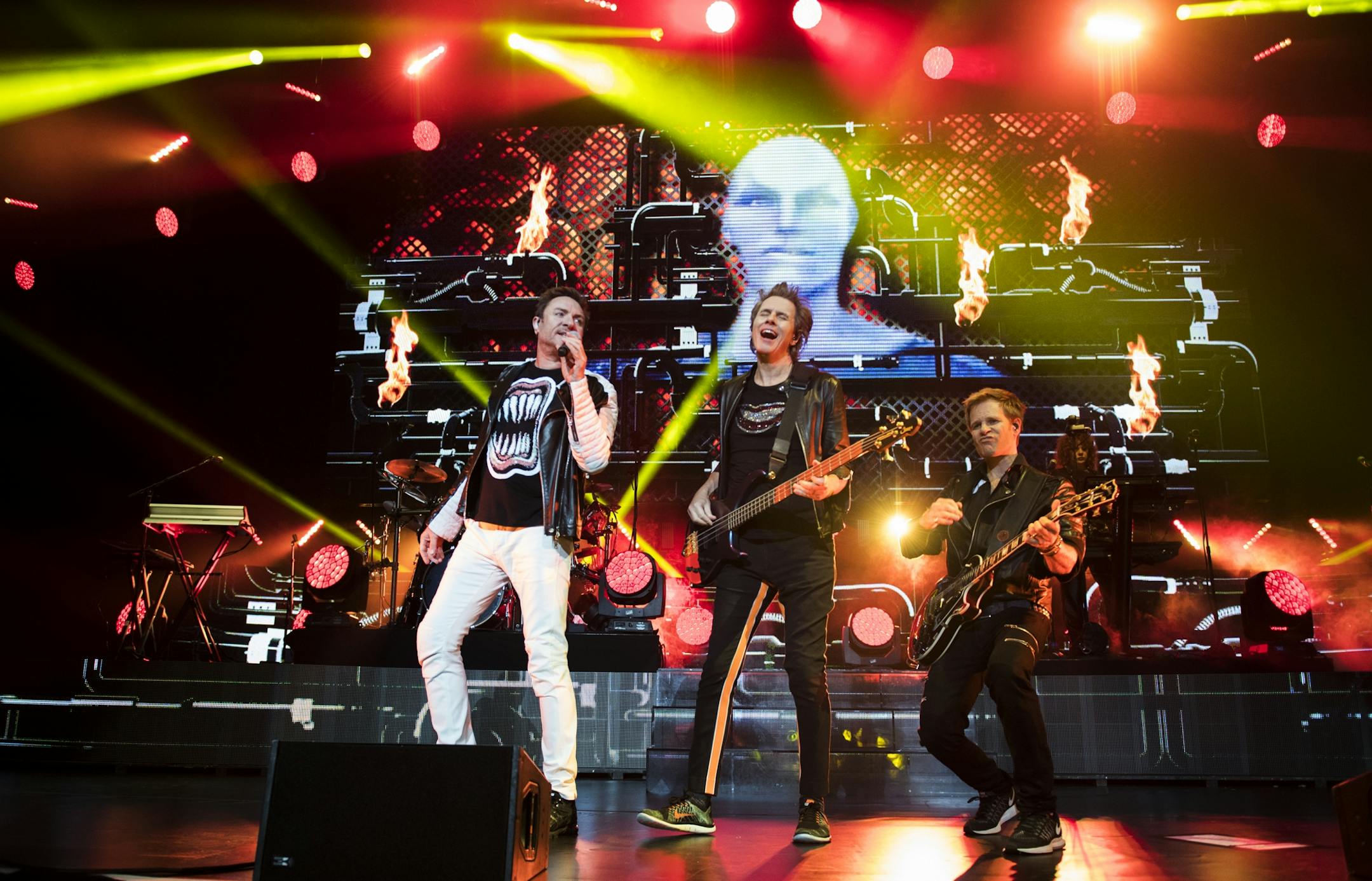 From left, Simon Le Bon, John Taylor and Dominic Brown performed with the rest of Duran Duran at the Xcel Energy Center on Saturday night.