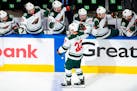 The Wild's Kevin Fiala is congratulated for a goal against the Canucks during the first period of Game 1