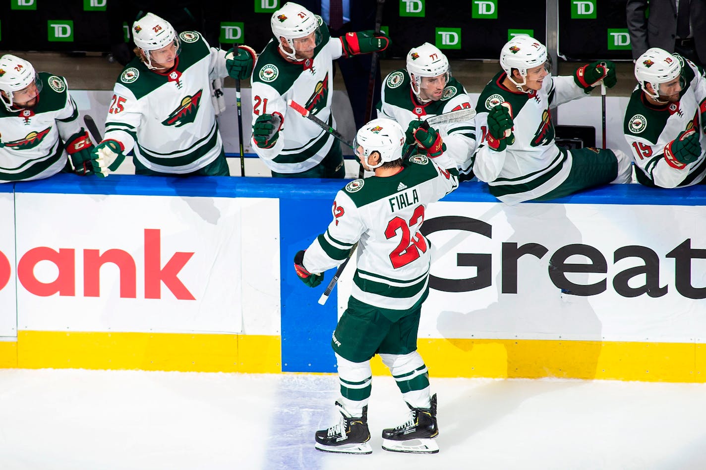 The Wild's Kevin Fiala is congratulated for a goal against the Canucks during the first period of Game 1