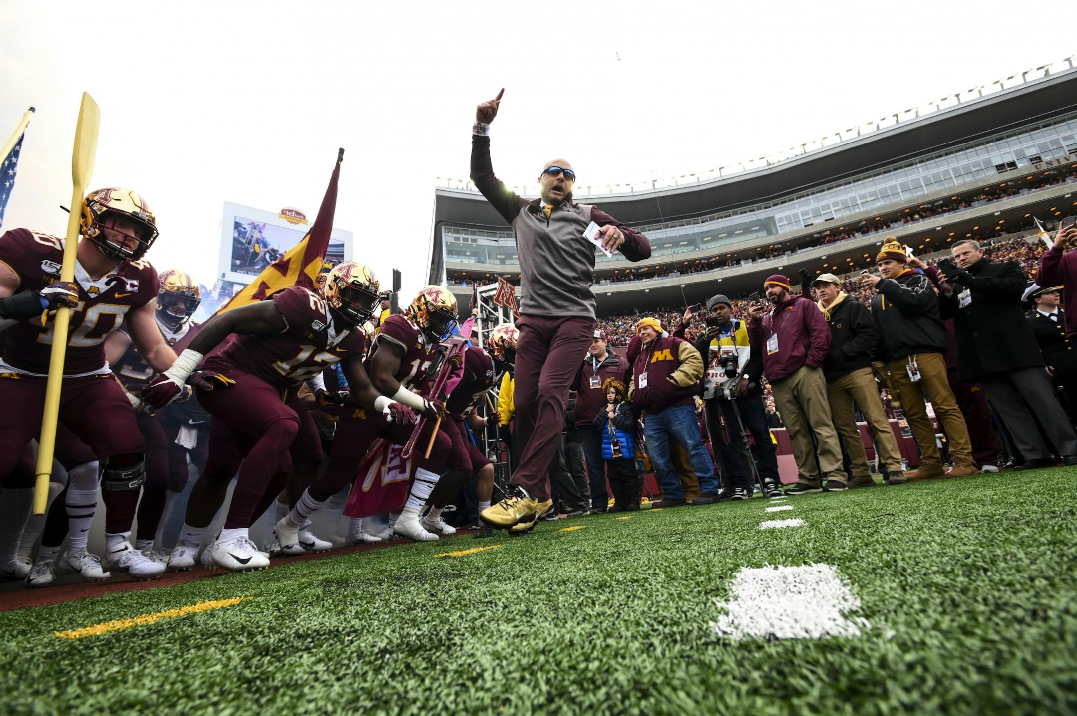 Minnesota Gophers head coach P.J. Fleck led the team onto the field before Saturday's game against the Penn State Nittany Lions.