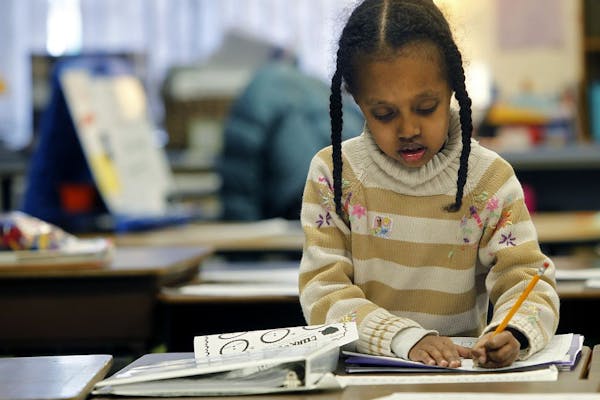 First-grader Nabat Bakri worked on her assignment Tuesday at Otsego Elementary School.