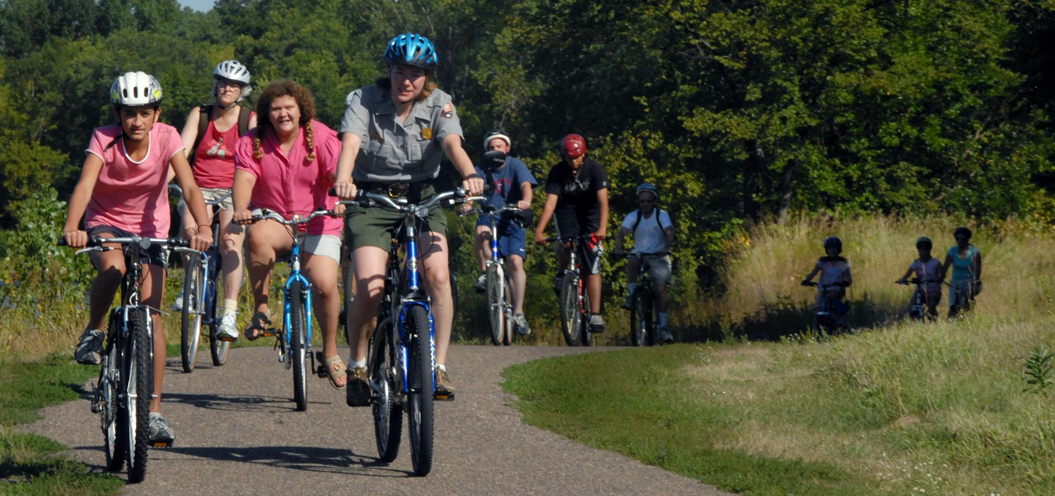 Bicyclists in East Coon Rapids Dam Regional Park.