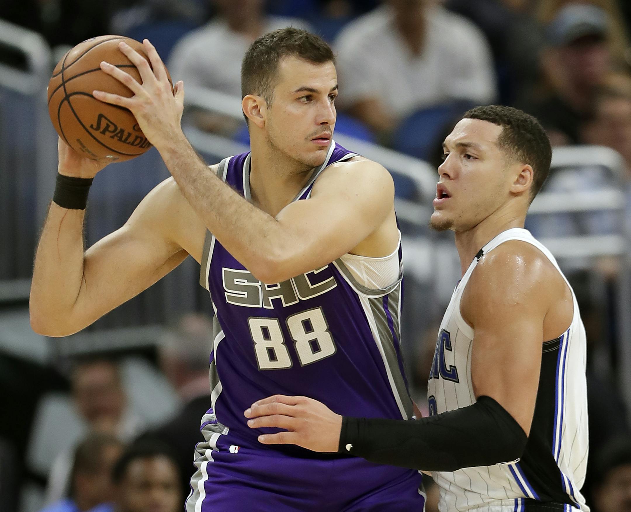 Sacramento Kings' Nemanja Bjelica (88) looks for a way past Orlando Magic's Aaron Gordon, right, during the second half of an NBA basketball game, Tuesday, Oct. 30, 2018, in Orlando, Fla. (AP Photo/John Raoux) ORG XMIT: MIN2018110818095380