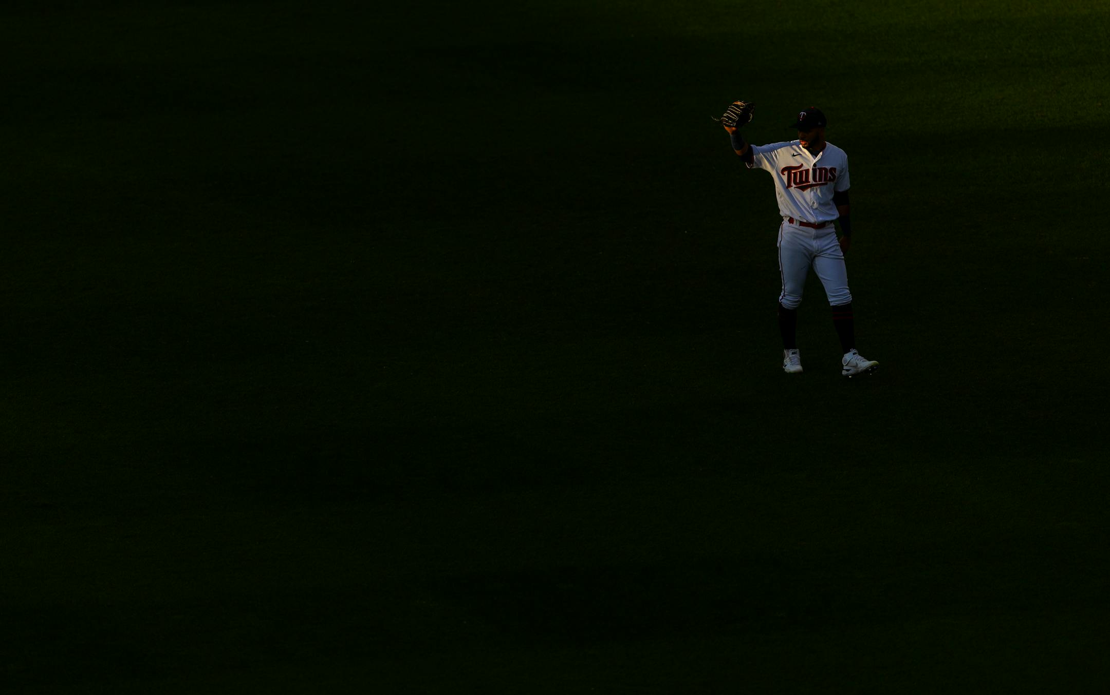 Minnesota Twins centerfielder Gilberto Celestino shaded his eyes from the sun in the first inning.