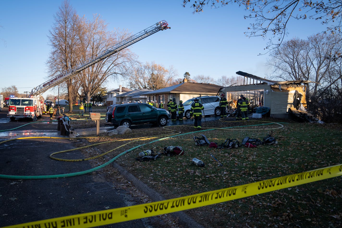 Fire crews work to put out a fire after a house explosion destroyed a home in South St. Paul, Minn. Thursday, Nov. 30, 2023. ] LEILA NAVIDI • leila.navidi@startribune.com