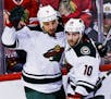 Minnesota Wild right wing Chris Stewart (7) celebrates his goal against the Chicago Blackhawks with center Jordan Schroeder (10) and center Tyler Grao