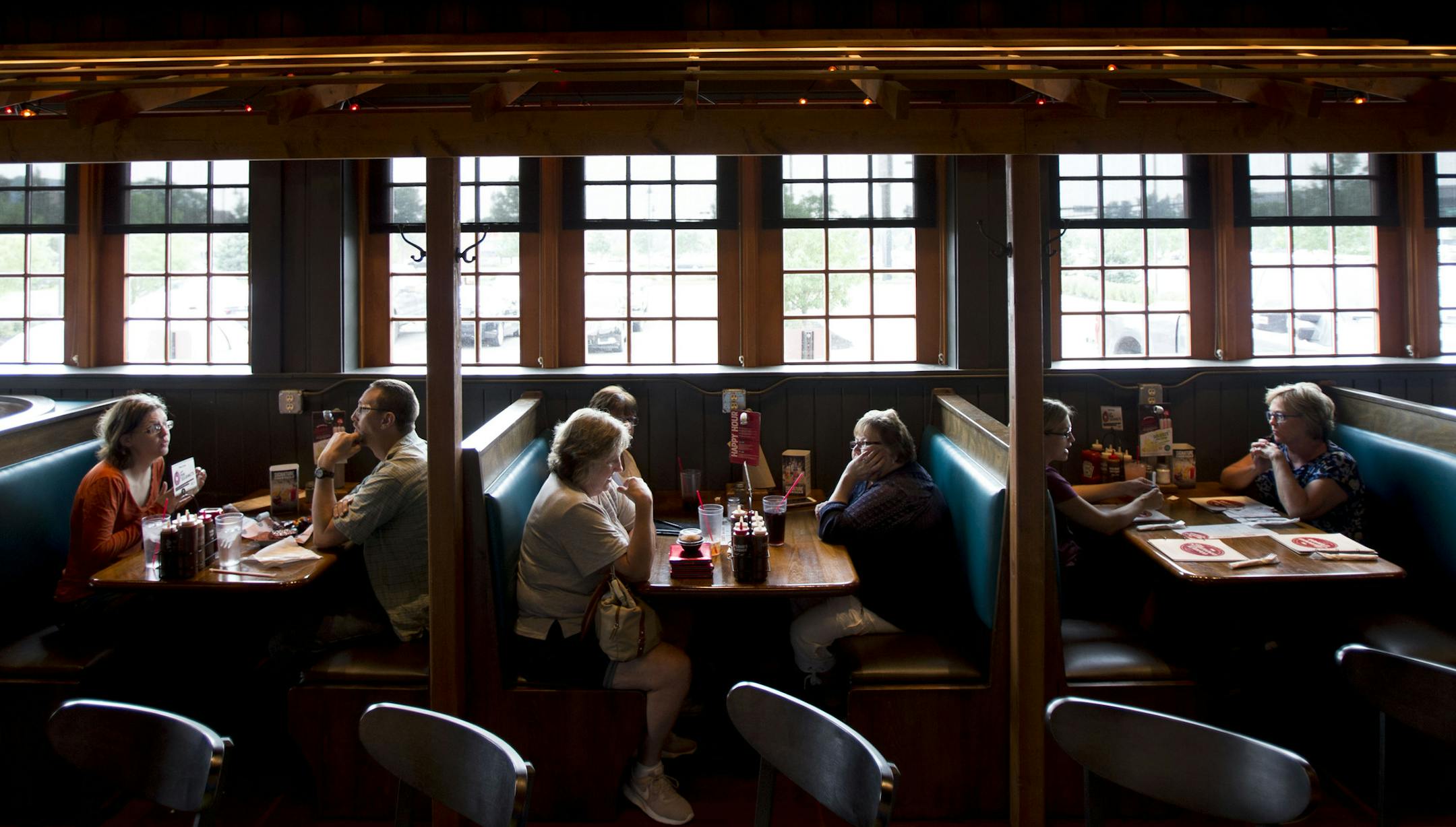 Lunch patrons sit in the bar area of Famous Dave's in Coon Rapids to enjoy a meal off their new menu. ] ALEX KORMANN • alex.kormann@startribune.com Famous Dave's Coon Rapids location recently did a twelve week menu overhaul where they introduced new dishes to only that location as an experiment of sorts. New items include chicken and waffles, jalapeño and cheddar stuffed sausage, mini doughnuts and a sweet potato soufflé. The new menu has pulled in more customers excited about t
