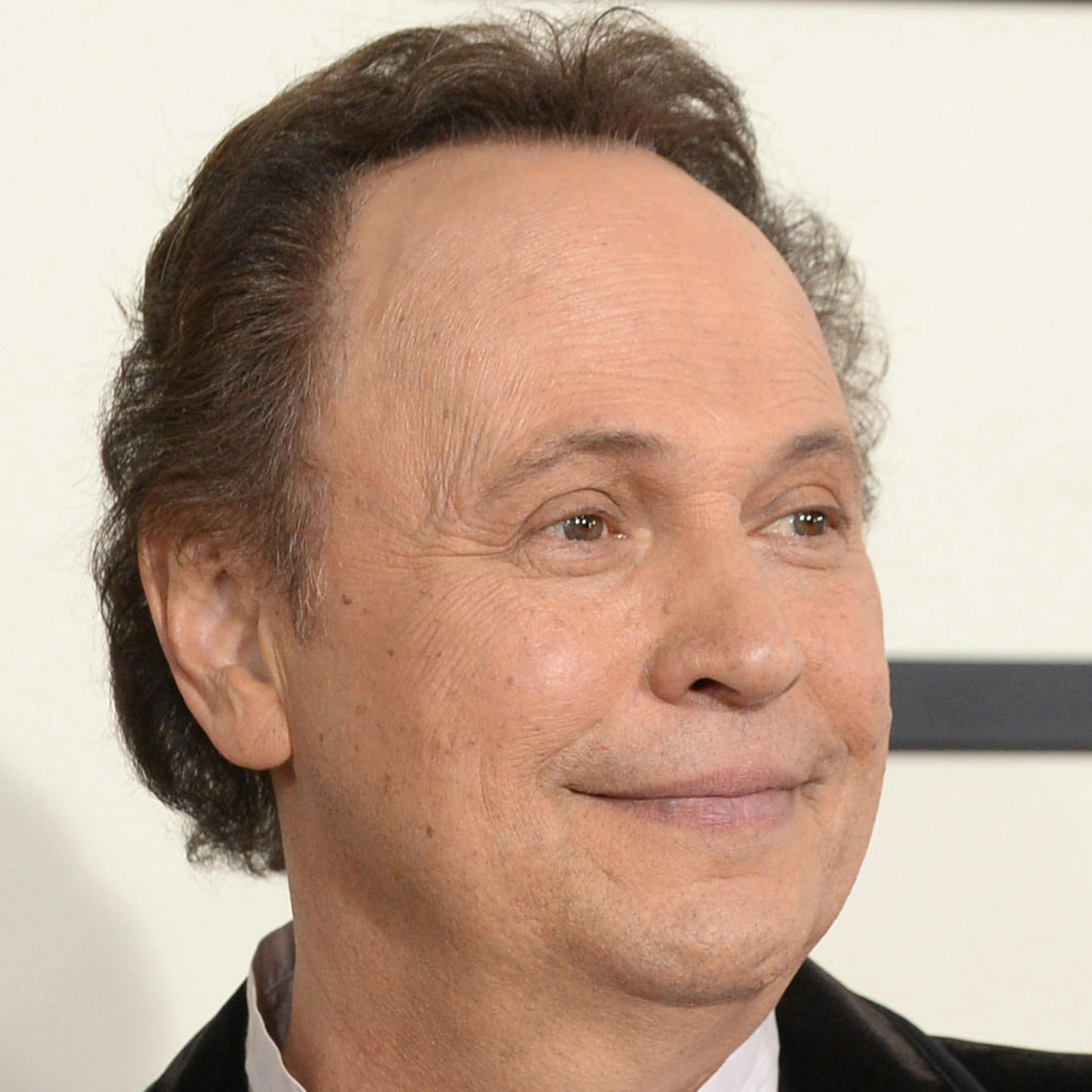 Janice Crystal, left, and Billy Crystal arrive for the 56th annual GRAMMY Awards at Staples Center on Sunday, Jan. 26, 2014, in Los Angeles. (Photo by Jordan Strauss/Invision/AP)
