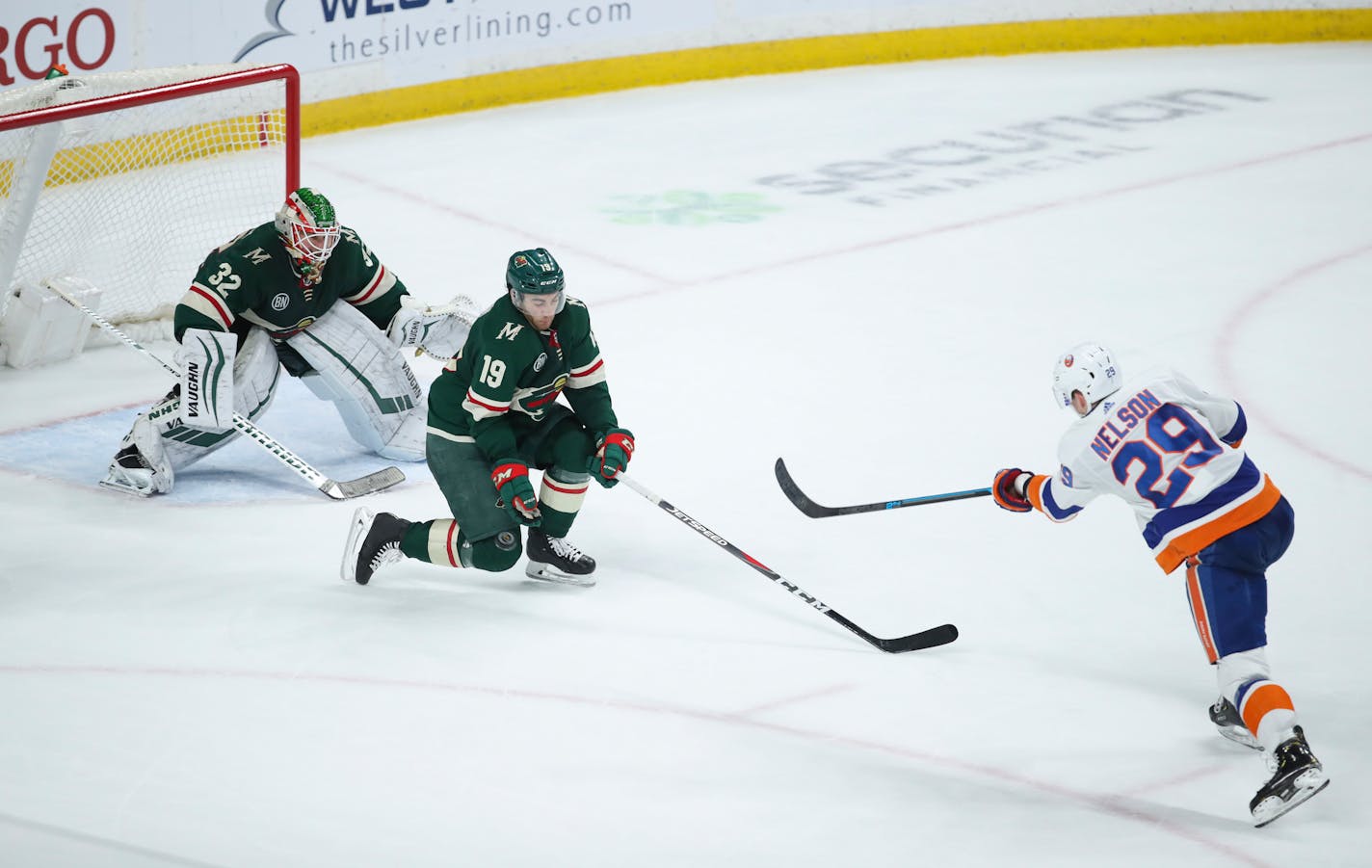 Islanders center Brock Nelson scored the game-winner on a wrist shot in overtime on Wild goaltender Alex Stalock with center Luke Kunin defending.