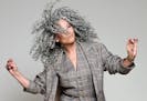 Author Lorraine Massey embraces her hair: curls, silver grays and all.