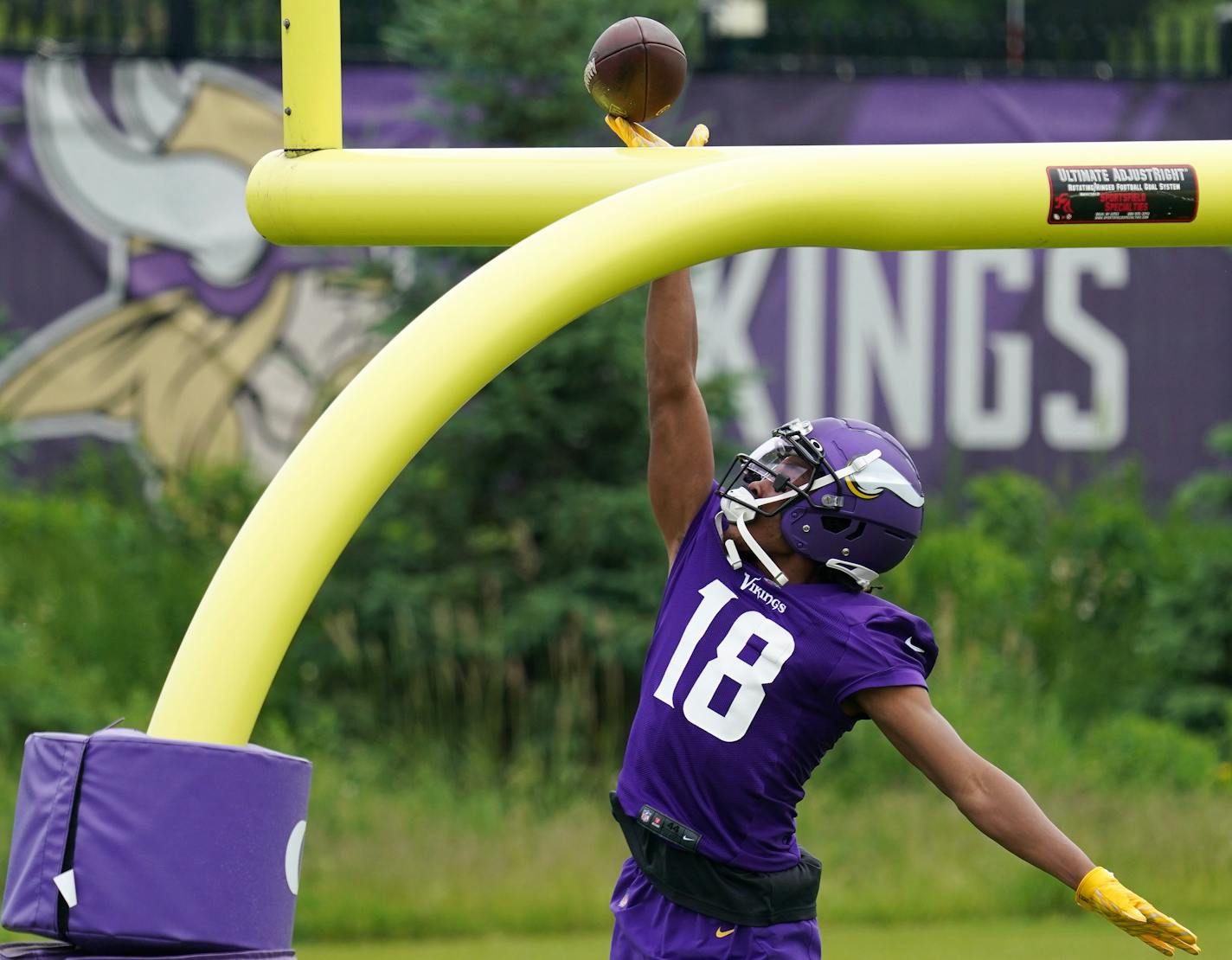 Minnesota Vikings wide receiver Justin Jefferson (18) tipped the ball over the goalpost after completing a pass during Wednesday's offseason workout. ] ANTHONY SOUFFLE • anthony.souffle@startribune.com