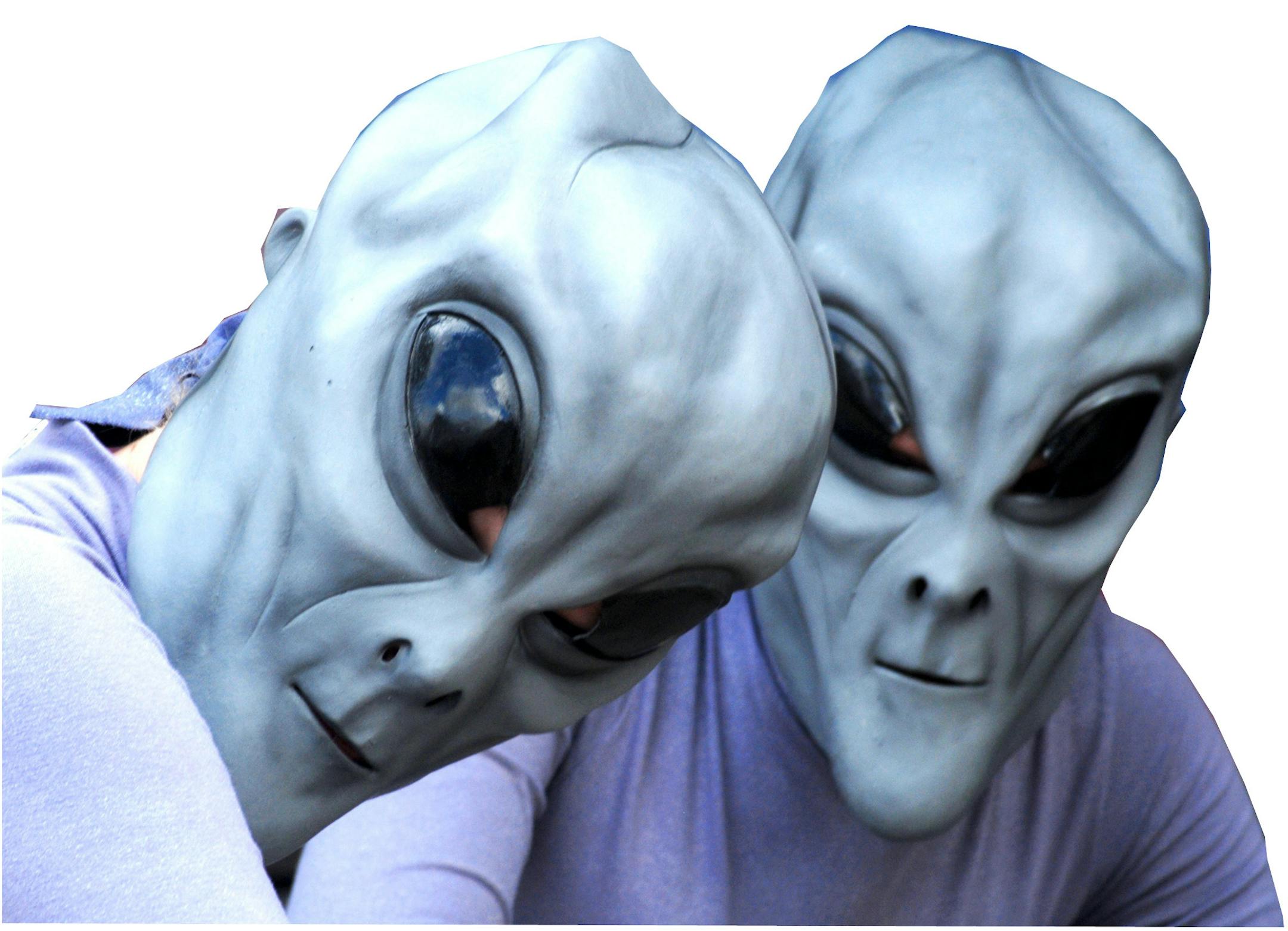 Two "aliens" pose for a photograph in front of Imagine That Scrapbooks on Main Street in downtown Roswell, N.M., Friday, July 6, 2007, during the UFO Festival. New Traditions Photography offered a chance for festival goers to have their photos taken with the aliens.