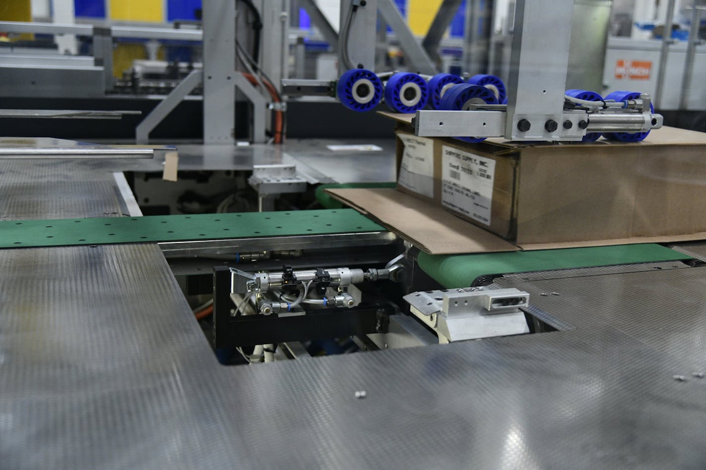 A machine at the Best Buy warehouse in Compton, Calif., builds shipping boxes to the exact size of the item, eliminating waste and the need for plastic bubble.(Best Buy handout photo)