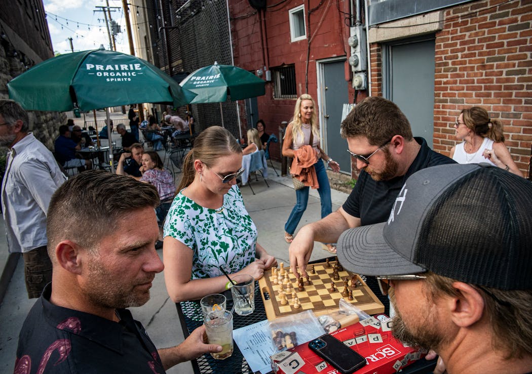 Sarah and Tyler DePaulis played chess on the extended patio in Stillwater.