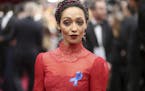 Ruth Negga, wearing the ACLU ribbon, arrives at the Oscars on Sunday, Feb. 26, 2017, at the Dolby Theatre in Los Angeles. (Photo by Matt Sayles/Invisi