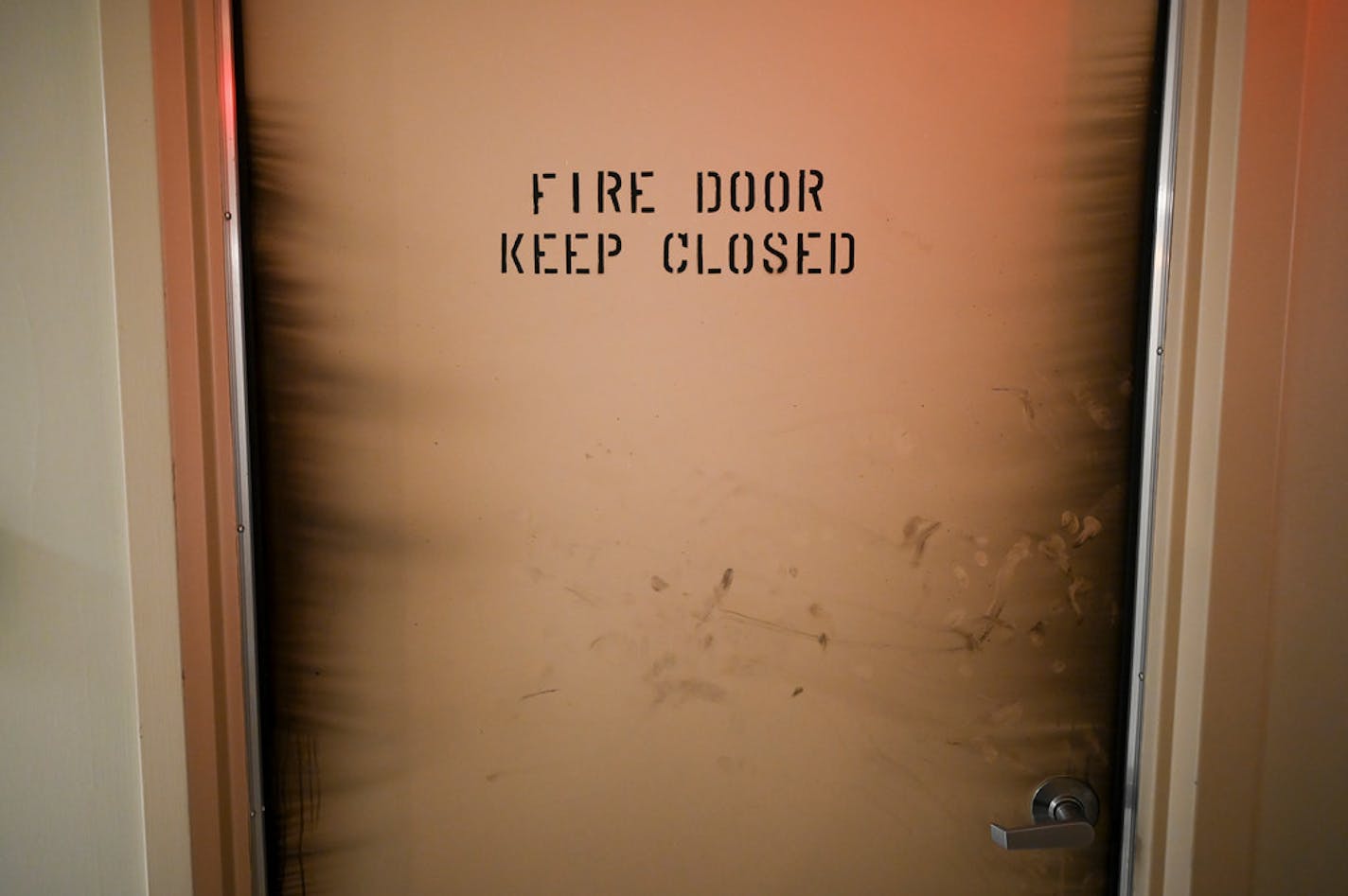 A fire door showed signs of smoke from Wednesday morning's fire on the 15th floor.