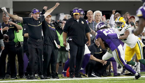 Vikings head coach Mike Zimmer reacted after Trae Waynes (26) intercepted a pass off of Green Bay Packers quarterback Aaron Rodgers in the fourth quar