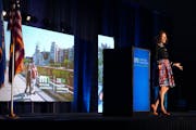 Lauren Bennett McGinty, executive director of Explore Minnesota, speaks to more than 500 travel and tourism industry leaders from across the state dur