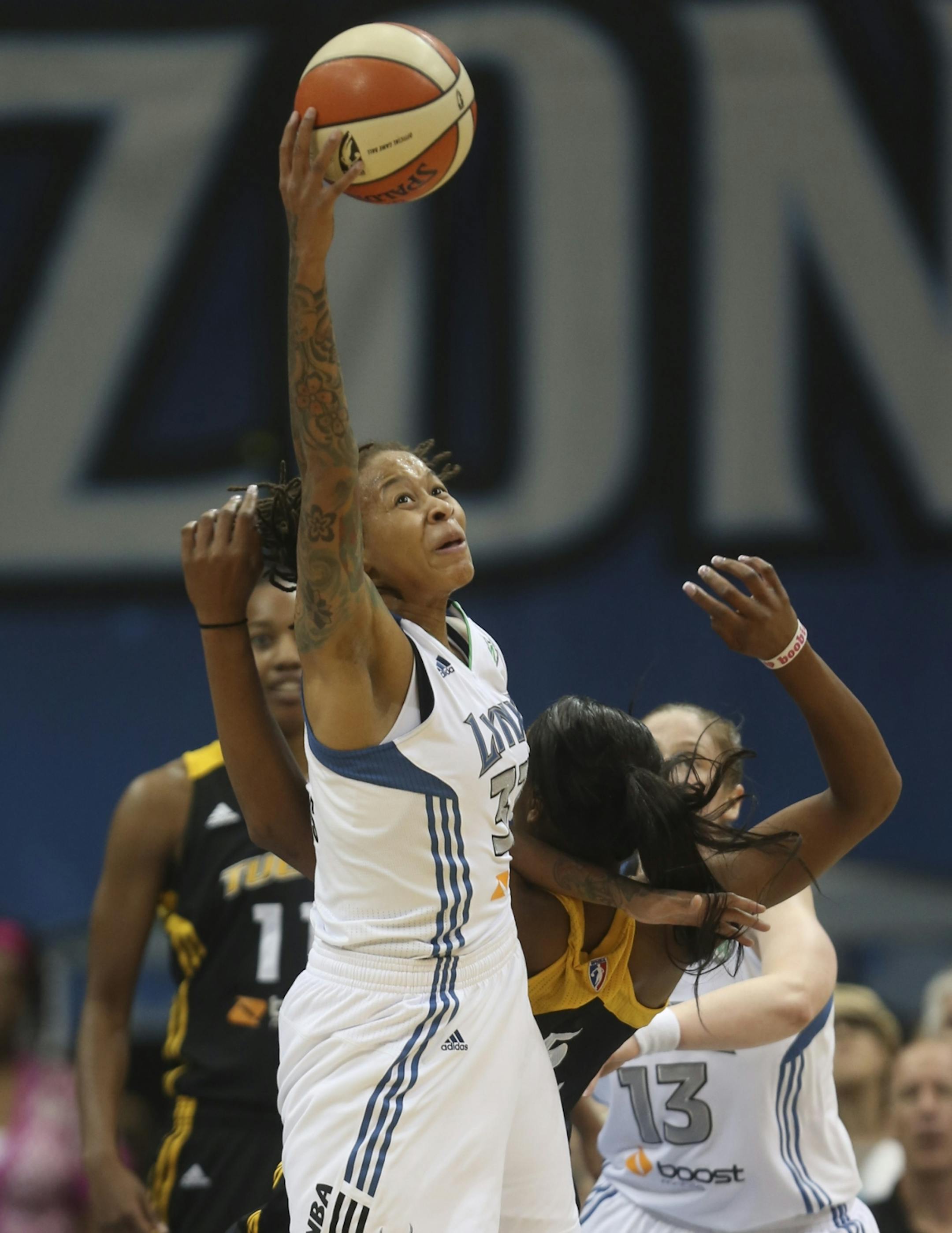 Lynx Seimone Augustus pulled down a defensive rebound during first half action at the Target Center in Minneapolis, Min., Friday August 31, 2012.