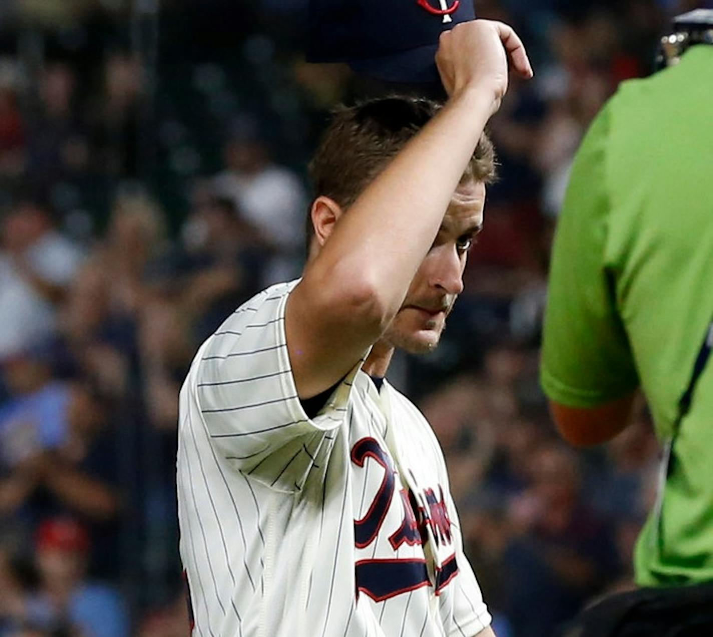 Minnesota Twins pitcher Jake Odorizzi doffs his cap to an ovation when he was pulled in the eighth inning