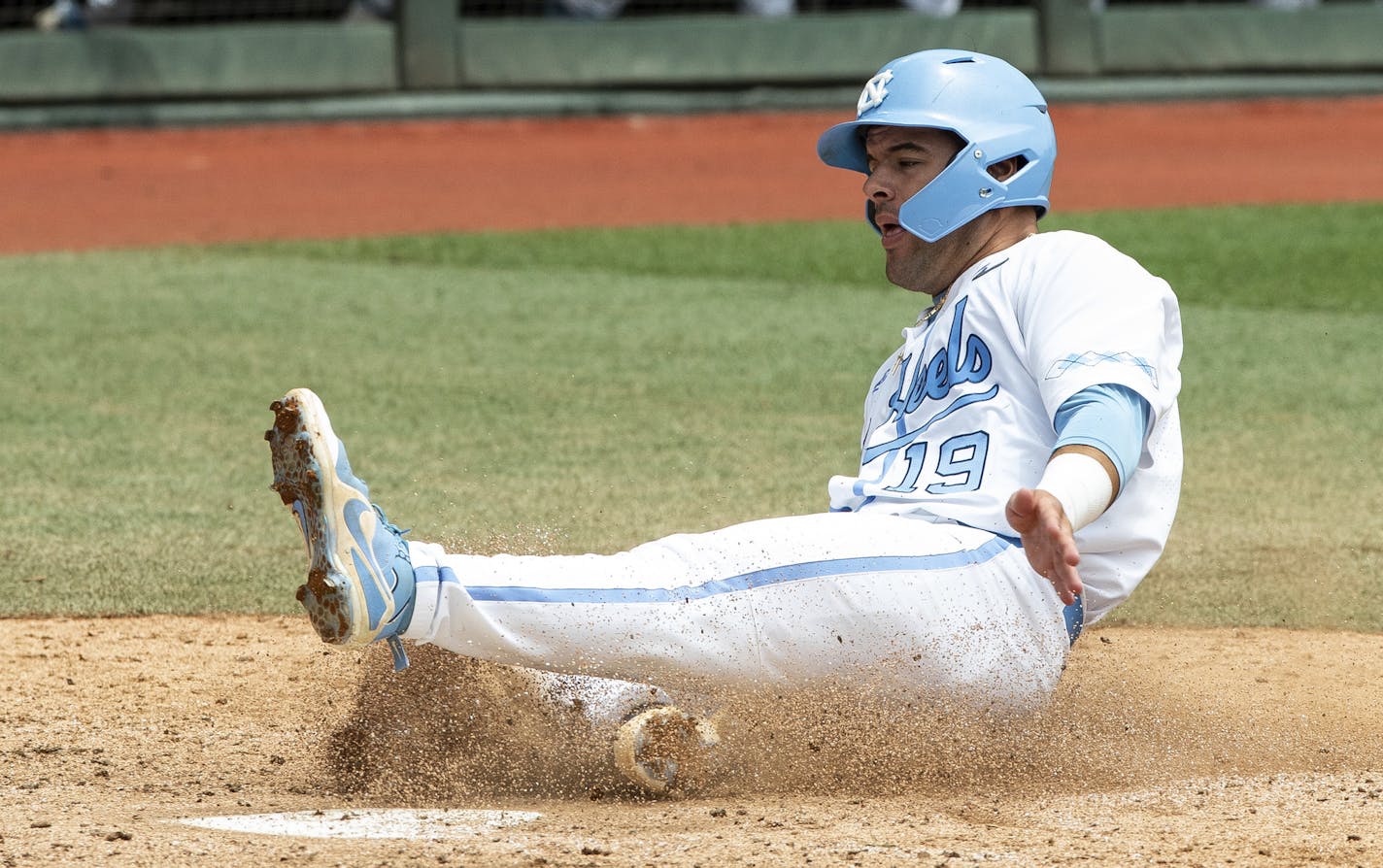 FILE - In this June 8, 2019, file photo, North Carolina's Aaron Sabato scores a run against Auburn during Game 1 at the NCAA college baseball super regional in Chapel Hill, N.C. The Minnesota Twins selected Sabato during the first round of the baseball draft Wednesday, June 10, 2020. (AP Photo/Ben McKeown, File)